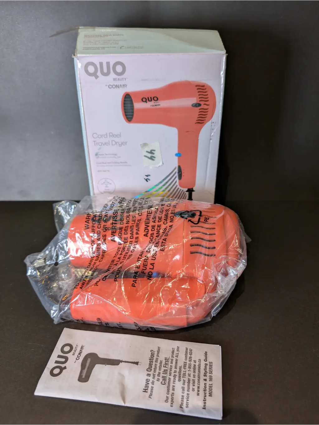 Quo Beauty by Conair Cord Reel Travel Dryer | Dual voltage